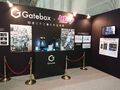 Exhibit showcasing Gatebox's Miku hologram, in her Gatebox design and her Gatebox Sakura design.