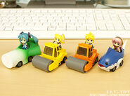 Nendoroid figurines showing Miku, Len, Rin and Luka in vehicles based on their items.