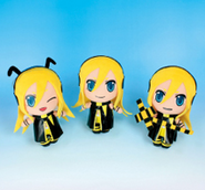 3 plush dolls of Lily, referencing her bee (left) and railroad signal (right).