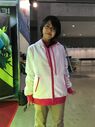 Model from C89 showing the PROJECT:AKAZA Hoodie, Front