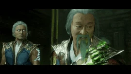 Shang Tsung applies healing magic on the wound he received from Baraka's blades.