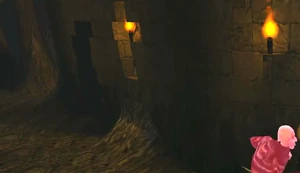 Secret door is a darker section of wall just past a recessed torch