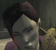 Alexandra Ruthven bends over her painting