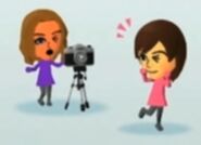 Rie and Alice in the screen that appears when uploading a video in Mario Kart 8.