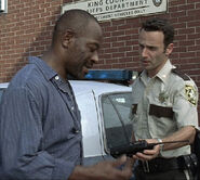 Rick giving Morgan the iconic handheld radio.