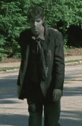 Black Suit Walker by Mike Kasiske King County, Georgia Walker roaming the streets, once killed, the sound of the gun lures more walkers to the area; Rick thought he was a man.