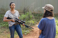 Sasha Williams Receives A Sniper Rifle from Rosita 7x14 Promotional Still