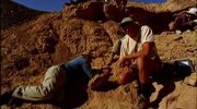 Philip Currie in Nemegt valley site with Tarbosaurus skull