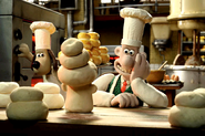 Wallace as a baker, admiring his sculpture of Piella made of dough