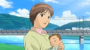 Megumi hold an Unnamed baby born in Miyazaki before Koichi reunited in anime Act 10.