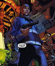 A picture of Wesley nervously holding a gun in his right hand.