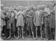 Starved prisoners, nearly dead from hunger, pose in concentration camp in Ebensee, Austria