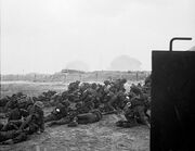 Infantry waiting to move off 'Queen White' Beach