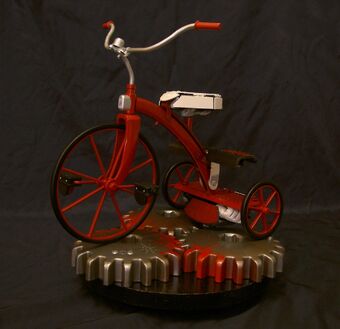 scary doll on tricycle