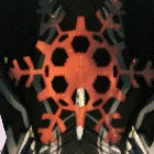 Festive Sigil with black base color and orange Warframe color in motion, This effect is shared with the Evergreen, Wreath, Tolling and Nistlebrush Sigils.