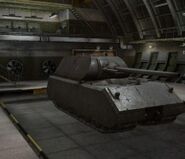 A front right view of a Maus in a garage