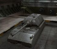 A front left view of a Maus in a garage