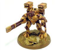 The XV88-2 Broadside Variant Battlesuit armed with a Smart Missile System