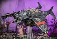 A Corvus Blackstar in flight over a xenos world.