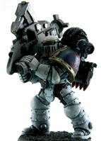 An ancient pict-capture of a Pre-Heresy World Eaters Legion Heavy Support Squad member with an early Proteus Pattern Missile Launcher