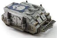 A Mark Ic Deimos Rhino of the Astral Claws Chapter, front-dorsal view.