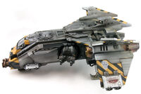 A Fire Raptor Gunship of the Iron Warriors Legion, profile view