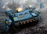 An Ultramarines Rhino leads the main thrust of an assault