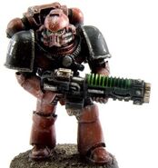 A Space Marine of the Great Crusade era armed with a Volkite Caliver