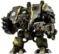 An Ironclad Dreadnought of the Red Scorpions Chapter armed with a Hurricane Bolter and an uncommon variant of the Seismic Hammer