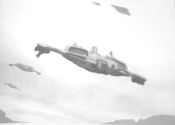 A flight of Barracudas fly as a fighter-escort for a pair of high-flying .