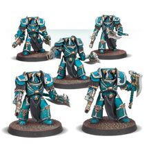An Alpha Legion Lernaean Terminator Squad armed predominantly with Volkite Chargers and Power Axes; one of the warriors is armed with a Conversion Beamer and a Power Axe.