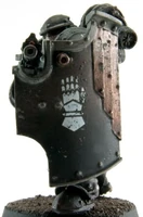 Iron Hands Legion Breacher Siege Squad member armed with Bolter and Boarding Shield, front view