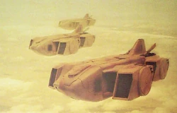 A squadron of Orcas transporting a  to battle.