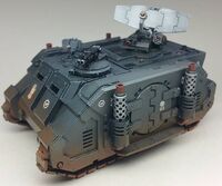 A Deimos Pattern Damocles Command Rhino of the Iron Hands Legion