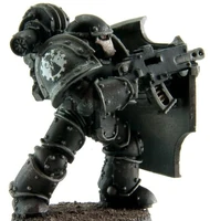 Iron Hands Legion Breacher Siege Squad member wielding Bolter and Boarding Shield, side view (opposite)