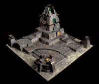 A Necron Tomb Citadel with a docked Monolith and twin-linked Tesla Destructor weapon emplacements.