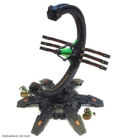 A Gauss Pylon attended by two Necron Warriors for size comparison