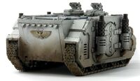 A Mark Ic Deimos Rhino of the Astral Claws Chapter, rear-side view.