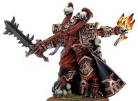 U'Zuhl, the infamous Bloodletter of Khorne, known as Skulltaker, mystically flays another victim's skull with eldritch flame