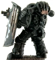 Iron Hands Legion Breacher Siege Squad member wielding Bolter and Boarding Shield, side view