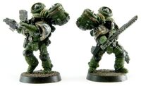 Two Salamanders Legionaries of an Assault Squad charge into battle