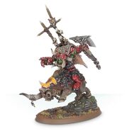 Warboss Gorbad Ironclaw mounted atop his war boar Gnarla.