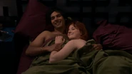Raj in bed with Emily.