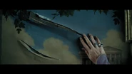 Dumbledore examining one of the slashes in the painting.