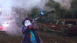 Joker shooting the Batwing