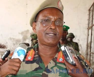 Генерал сомалийской армии, у которого на петлицы, помимо прочего, нашита желтая тесьма с "лучами".