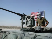 Трофейная каска фидаинов на американской бронемашине, Ирак, 2003 г.