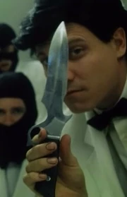 Член проекта "Разгром" с ножом .