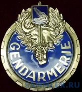 Знак почетного эскорта, который носится на портупее.