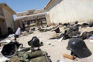 База фидаинов Саддама после вторжения американцев, 2003 г. На земле валяются брошенные характерные каски фидаинов.